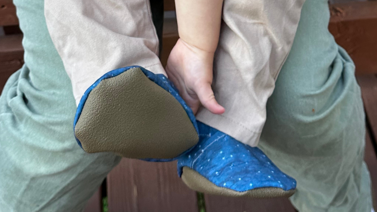 Lifestyle photo: Limited edition Summer Nights eco-canvas Cabooties baby shoes